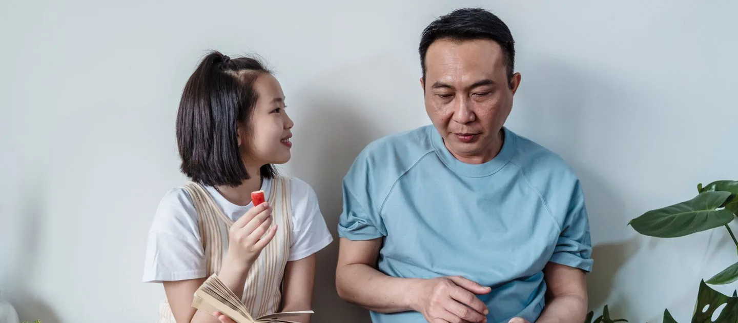 A father and child reading together